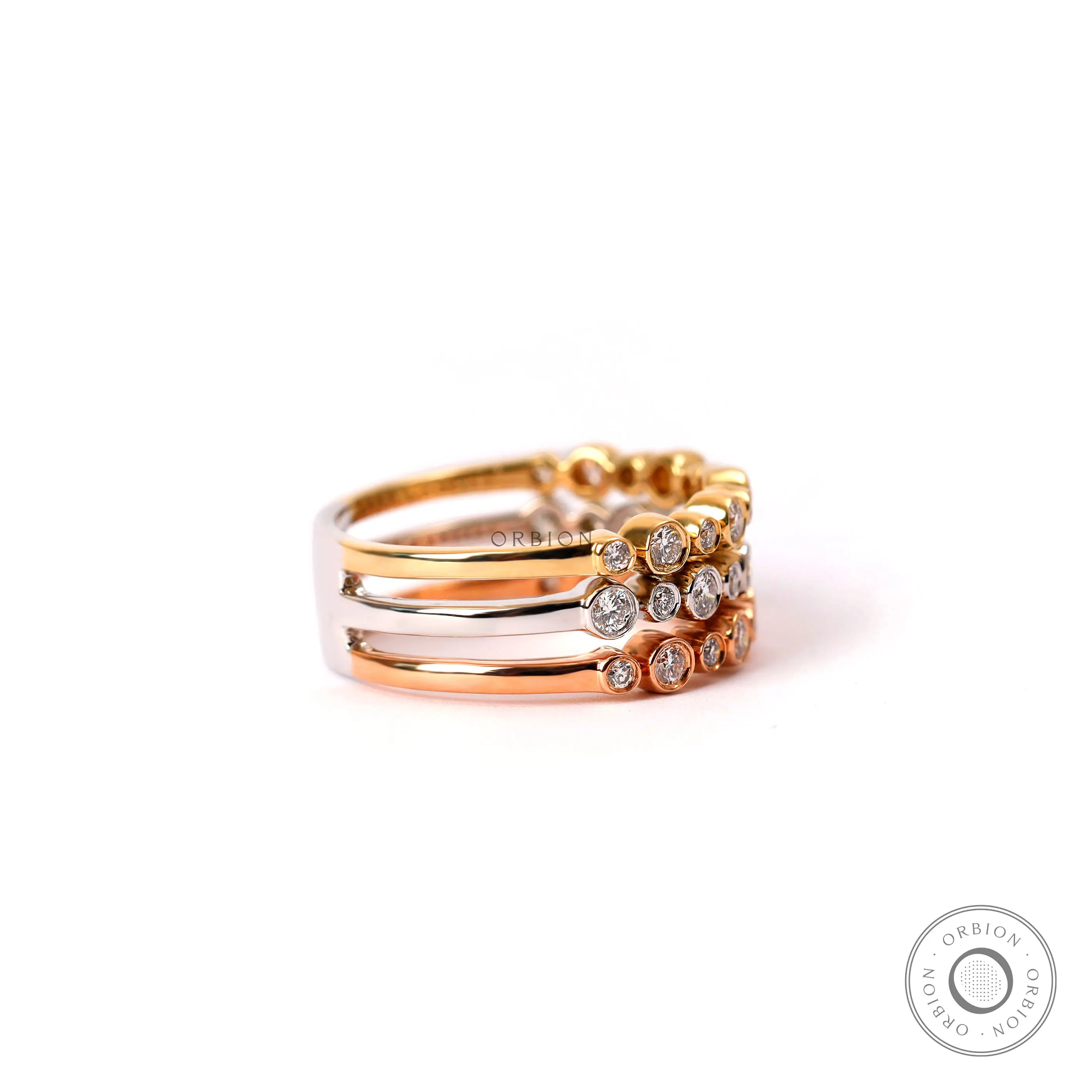 Three tone gold diamond anniversary ring stacked design top view