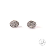 Oval shaped pave lab grown diamond cluster stud earrings in 14k white gold.