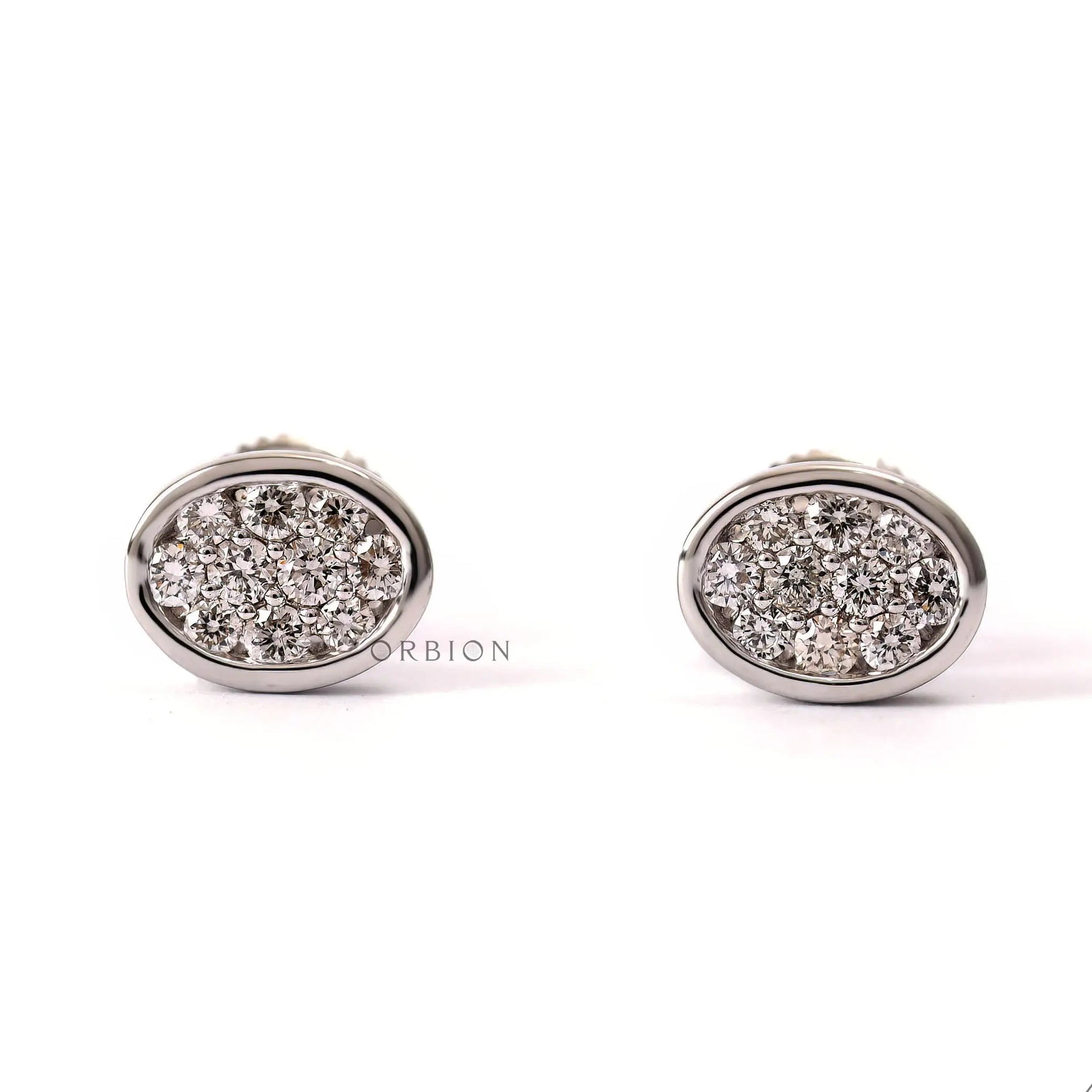 Oval shaped pave lab grown diamond cluster stud earrings in 14k white gold.