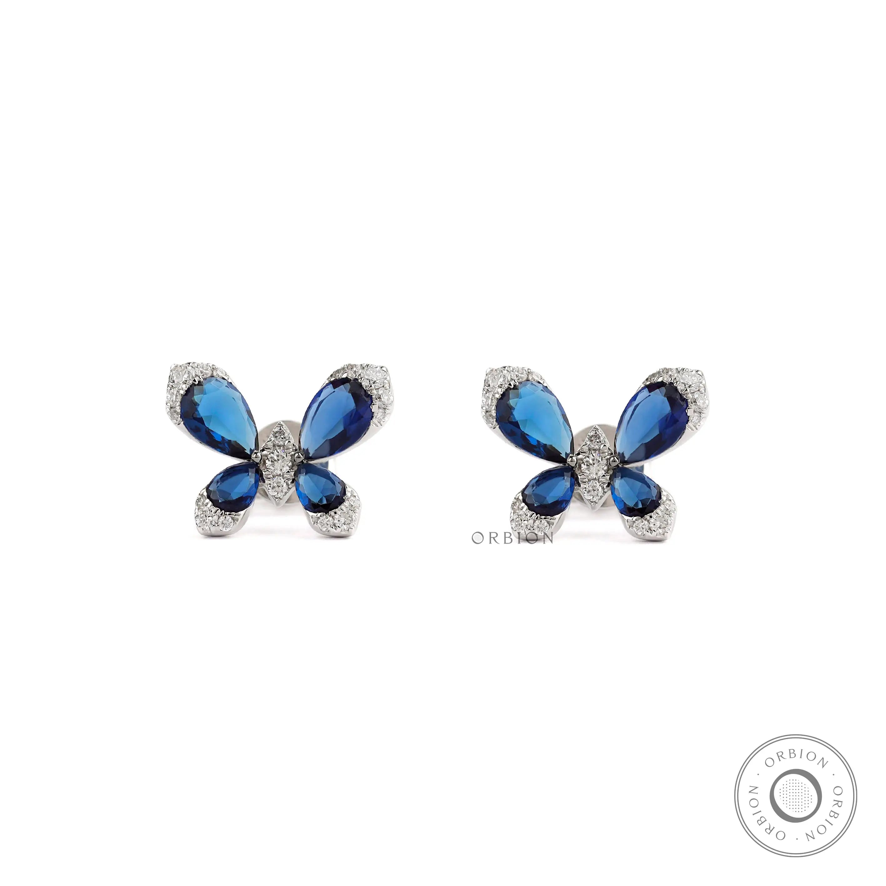 Blue sapphire butterfly stud earrings with diamond accents in white gold