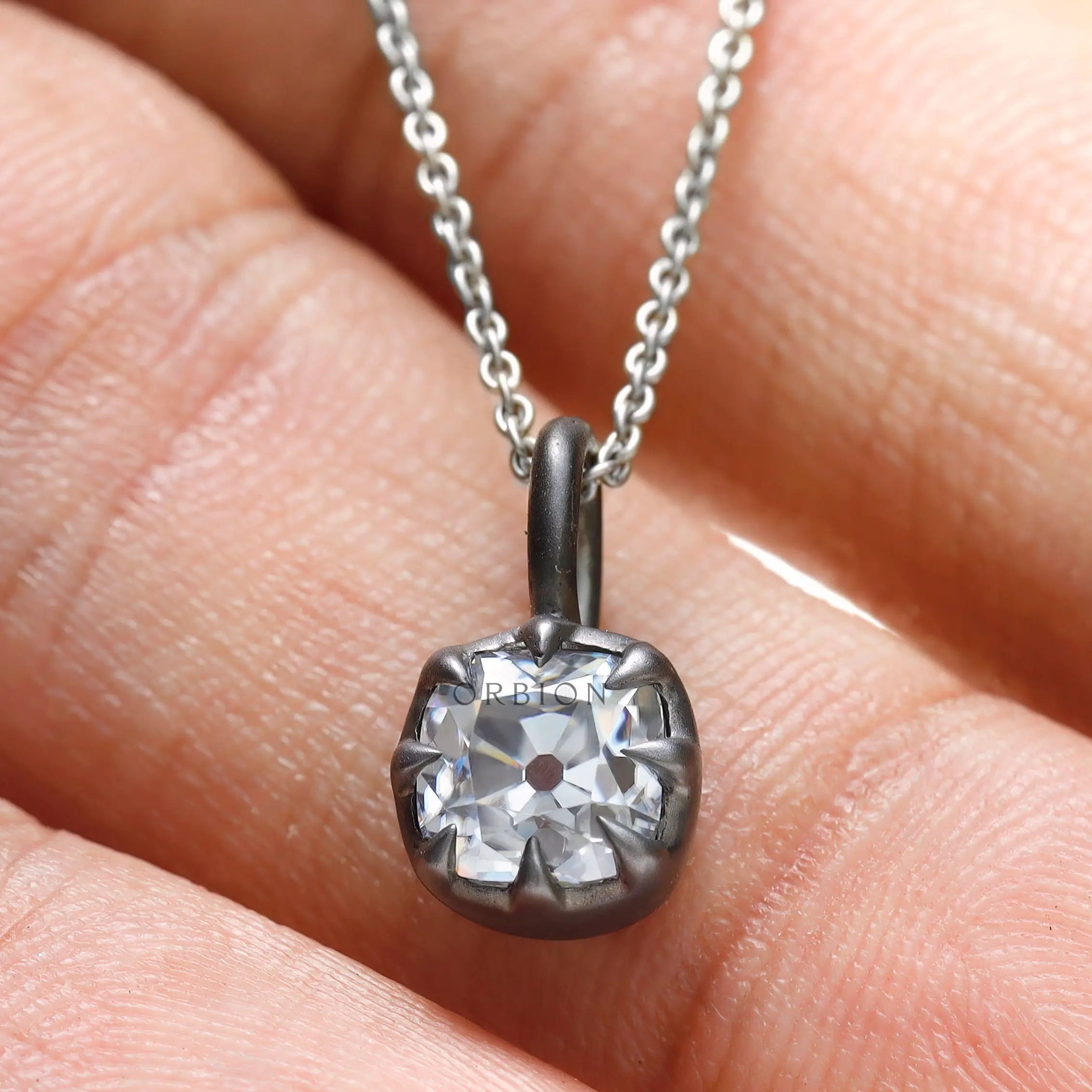 Old mine cut moissanite pendant in oxidized silver setting