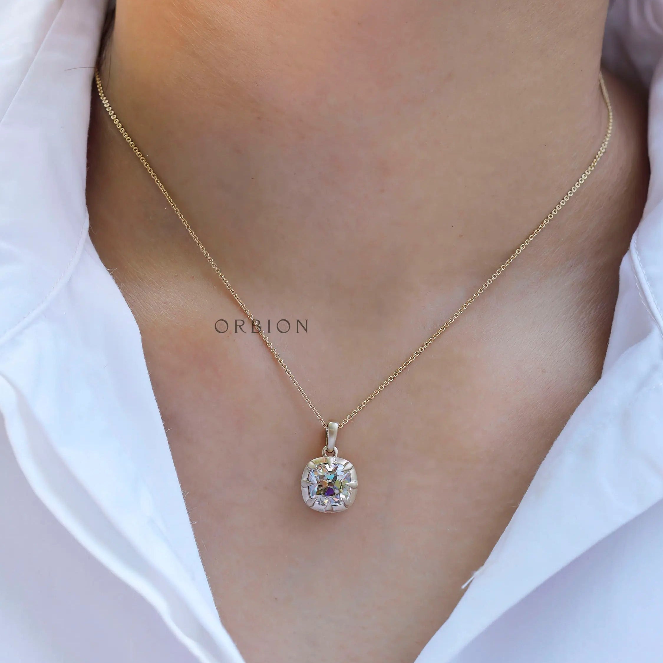 Antique style cushion pendant worn on neckline
