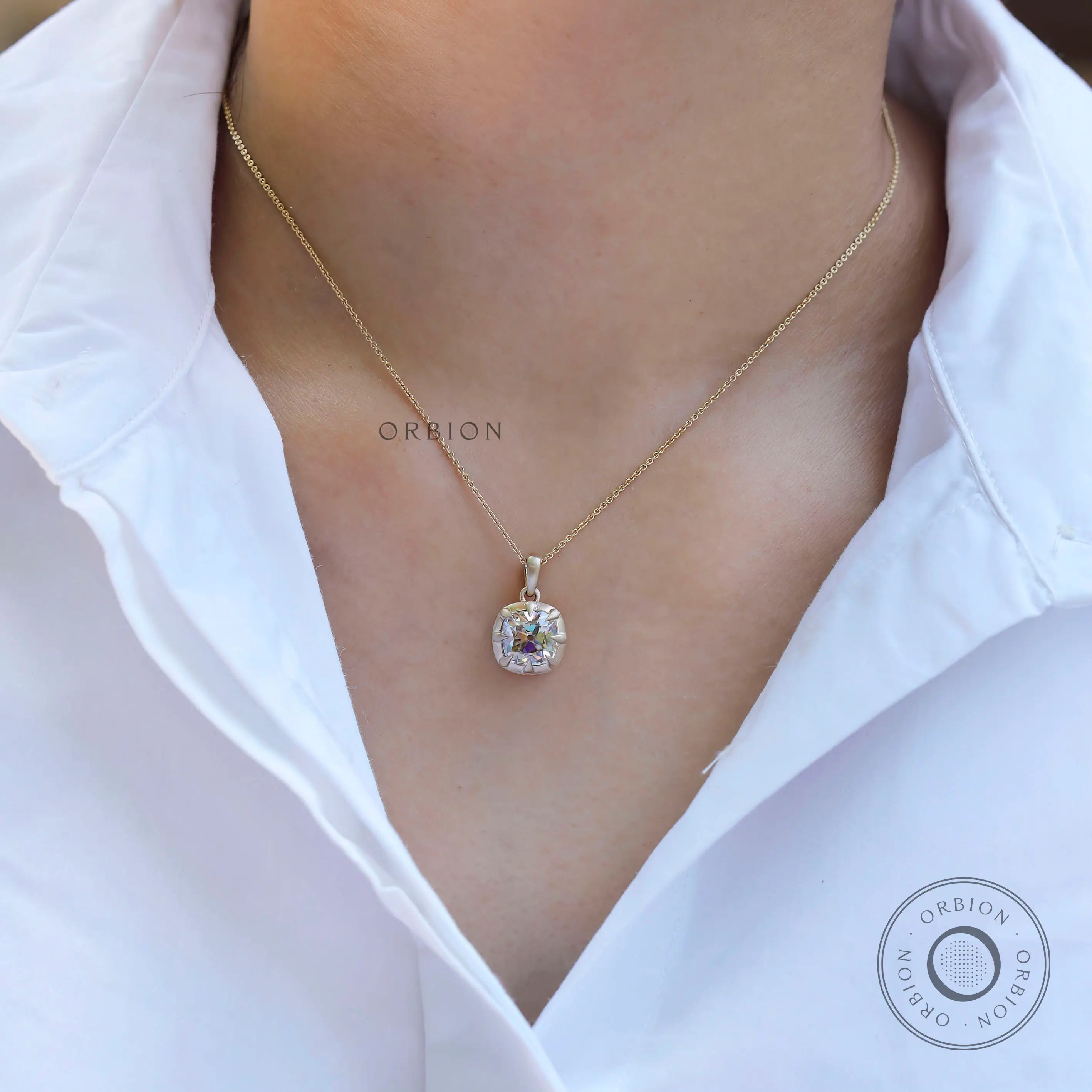 Antique style cushion pendant worn on neckline