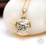 Off white cushion lab diamond pendant close up claw prong detail