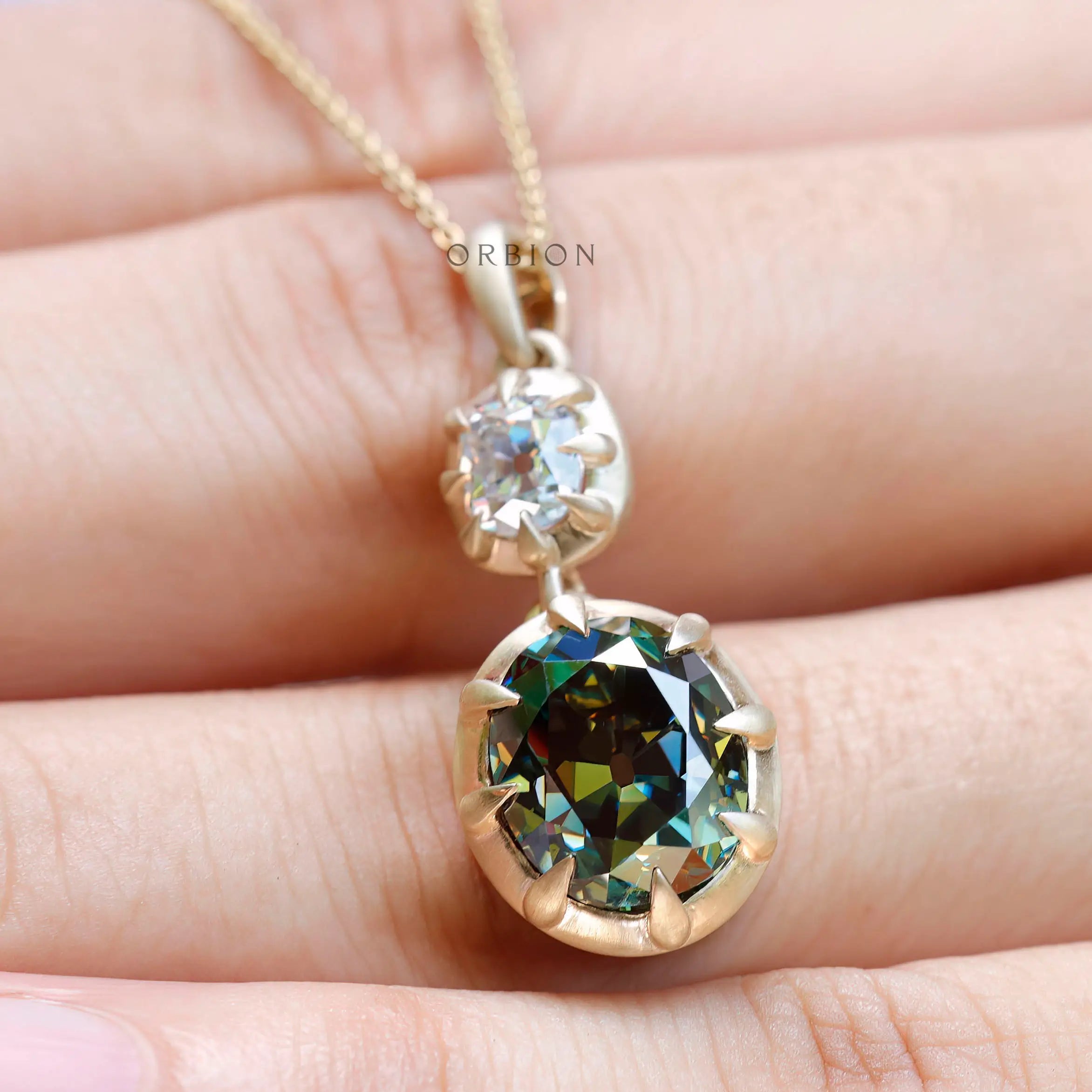 Satin matte 10K yellow gold two stone pendant close up