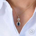 Vertical dangling & drop green and white moissanite pendant on model