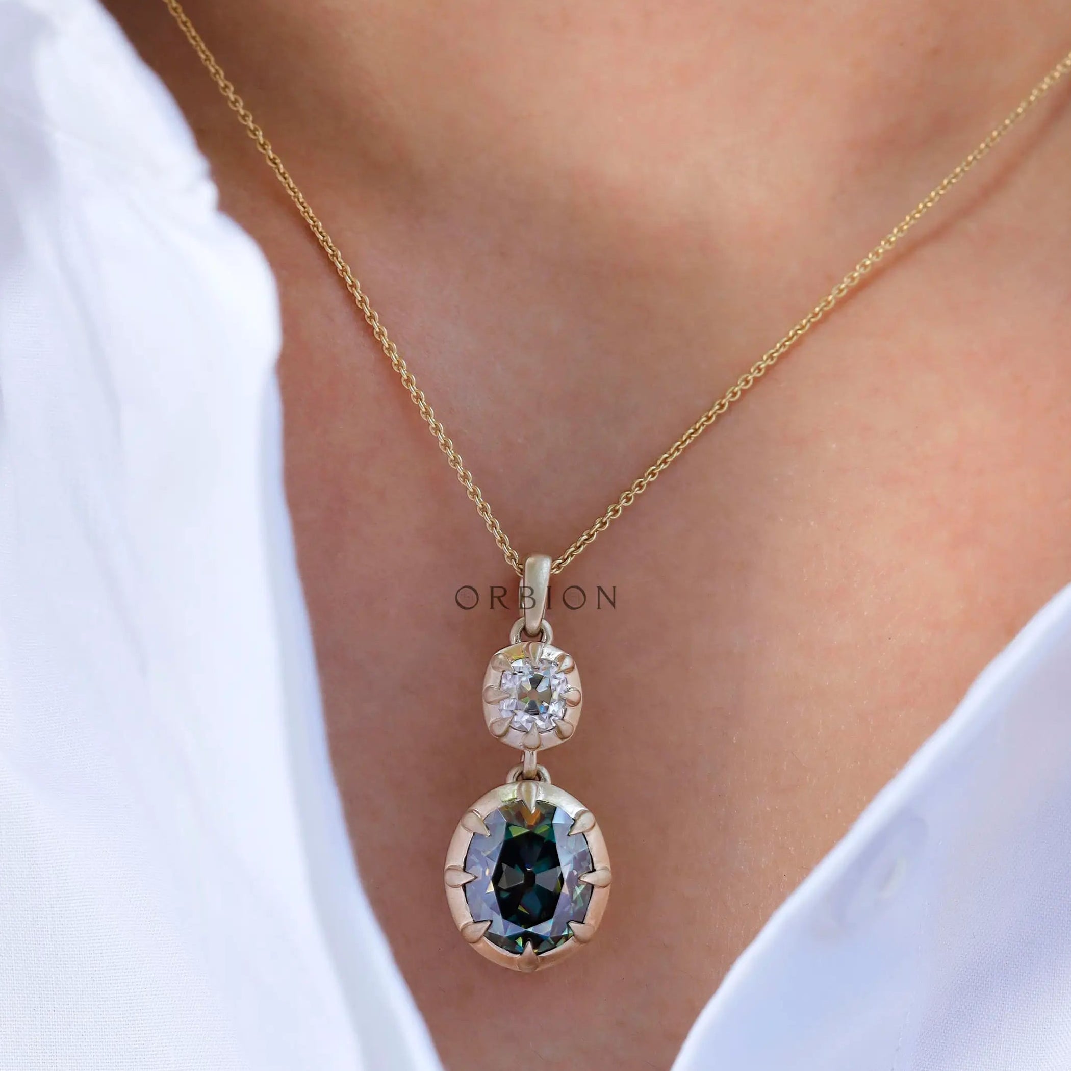 Vertical dangling & drop green and white moissanite pendant on model