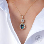 Antique style two stone vertical dangling moissanite pendant on model