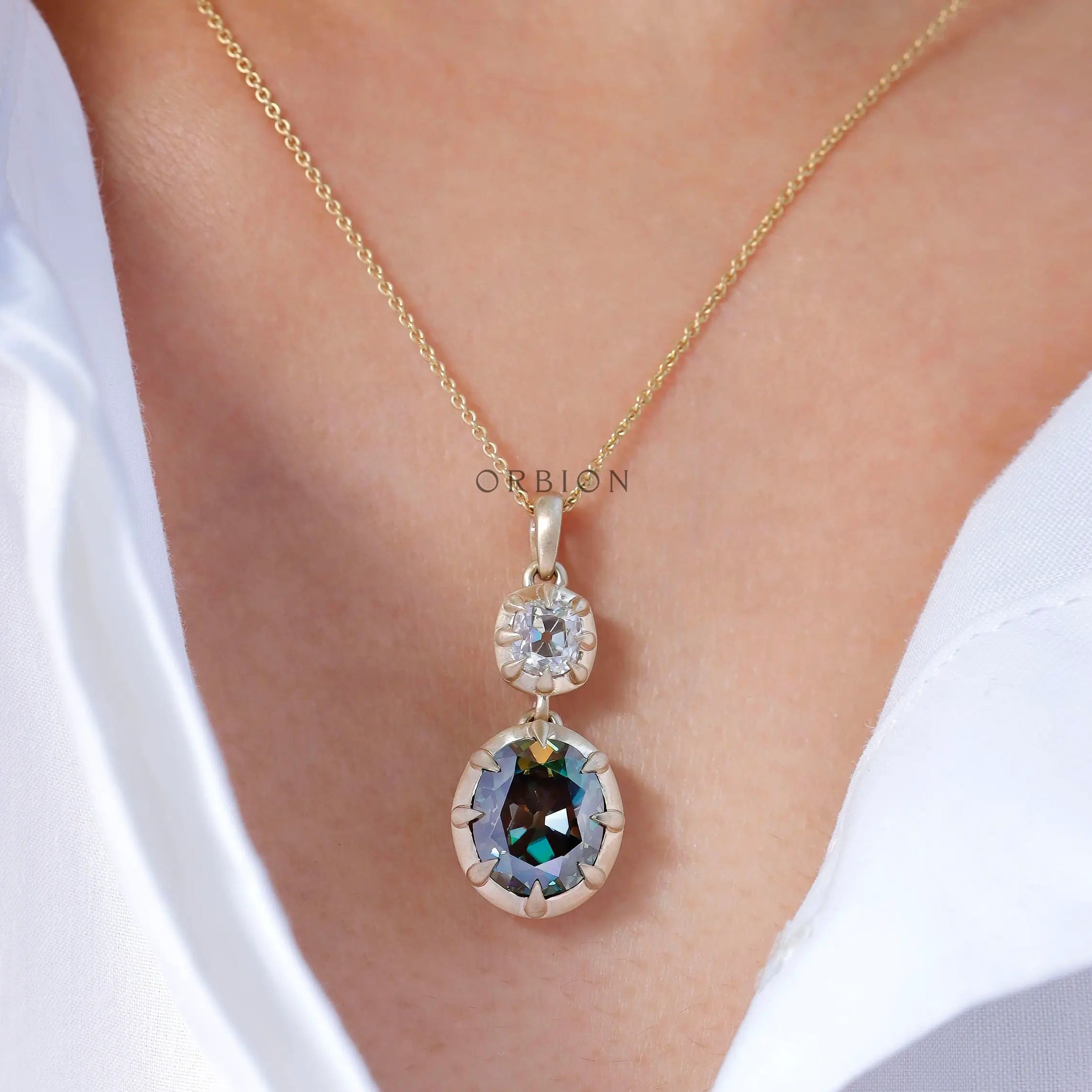 Antique style two stone vertical dangling moissanite pendant on model