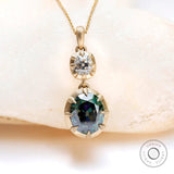Two stone green and white moissanite drop pendant in 10K yellow gold
