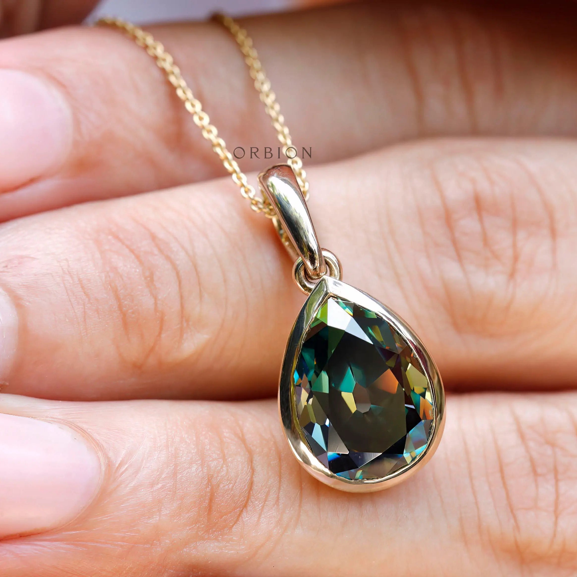 Pear old mine cut green moissanite pendant