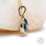 14K yellow gold glossy pear moissanite pendant front view