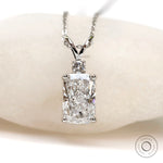 Front view elongated cushion lab diamond pendant with split V bail.