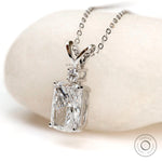 Angled front view of cushion diamond pendant in white gold.