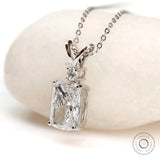 Angled front view of cushion diamond pendant in white gold.