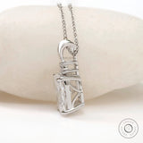Side profile of elongated cushion pendant with open gallery.