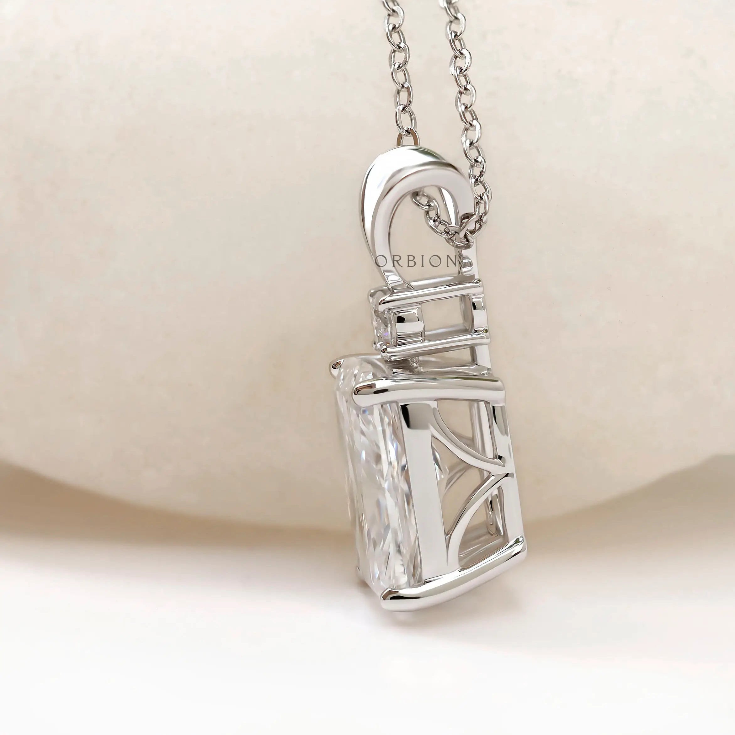 Side profile of elongated cushion pendant with open gallery.