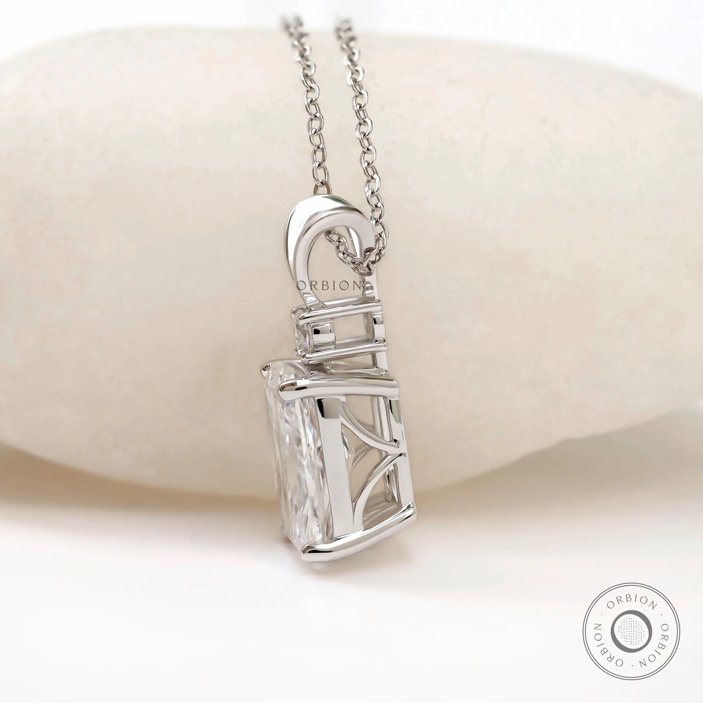 Side profile of elongated cushion pendant with open gallery.