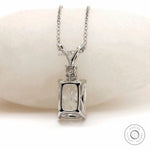 Back view of white gold pendant with structured gallery.