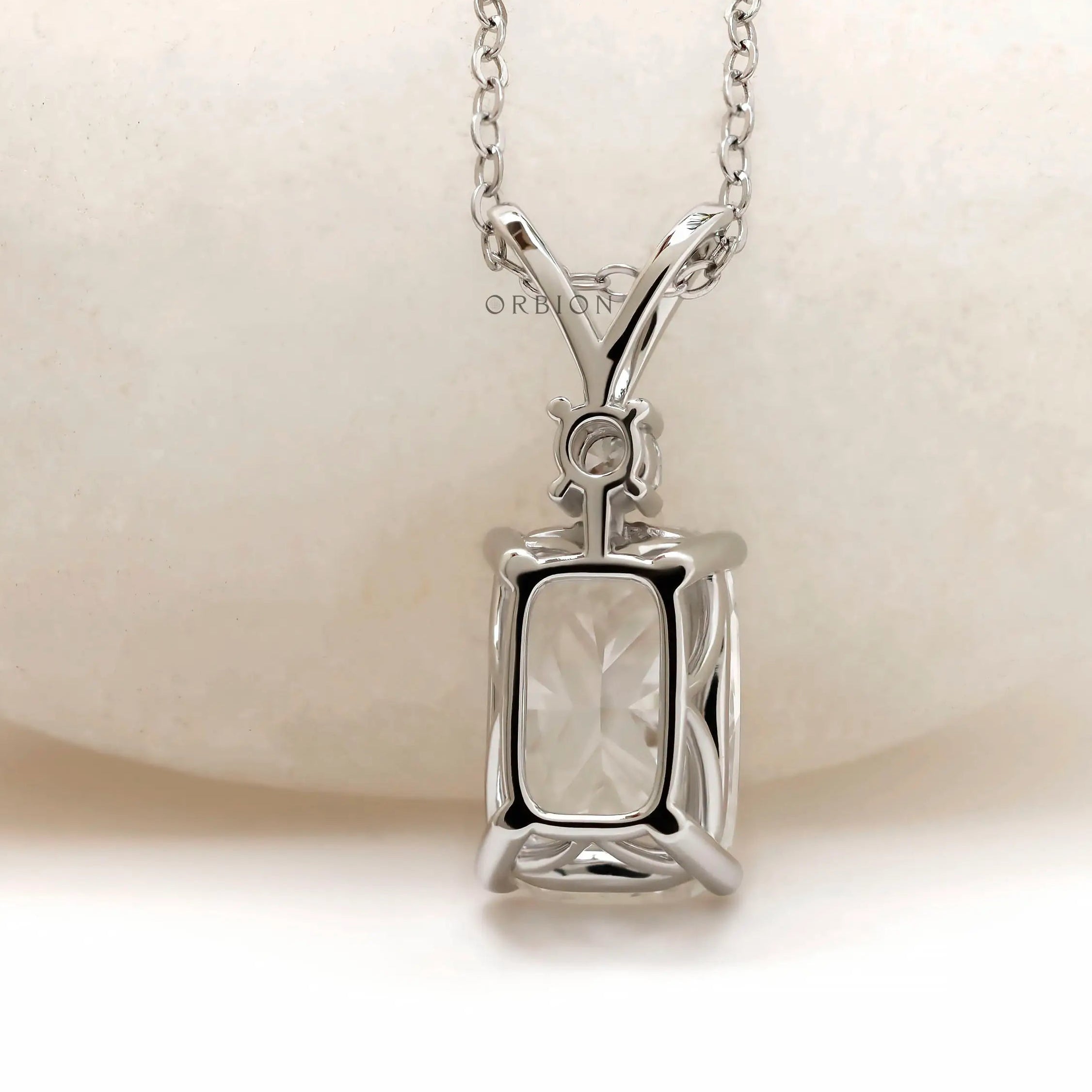 Back view of white gold pendant with structured gallery.