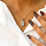 Worn neck view of elongated cushion diamond pendant necklace.