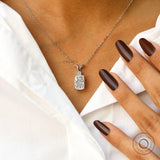Worn neck view of elongated cushion diamond pendant necklace.