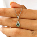 White gold oval moissanite pendant with classic solitaire design