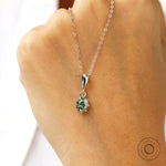 Antique style oval moissanite pendant with glossy white gold finish