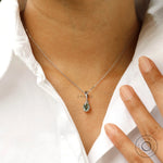 Elegant oval moissanite solitaire pendant necklace on model