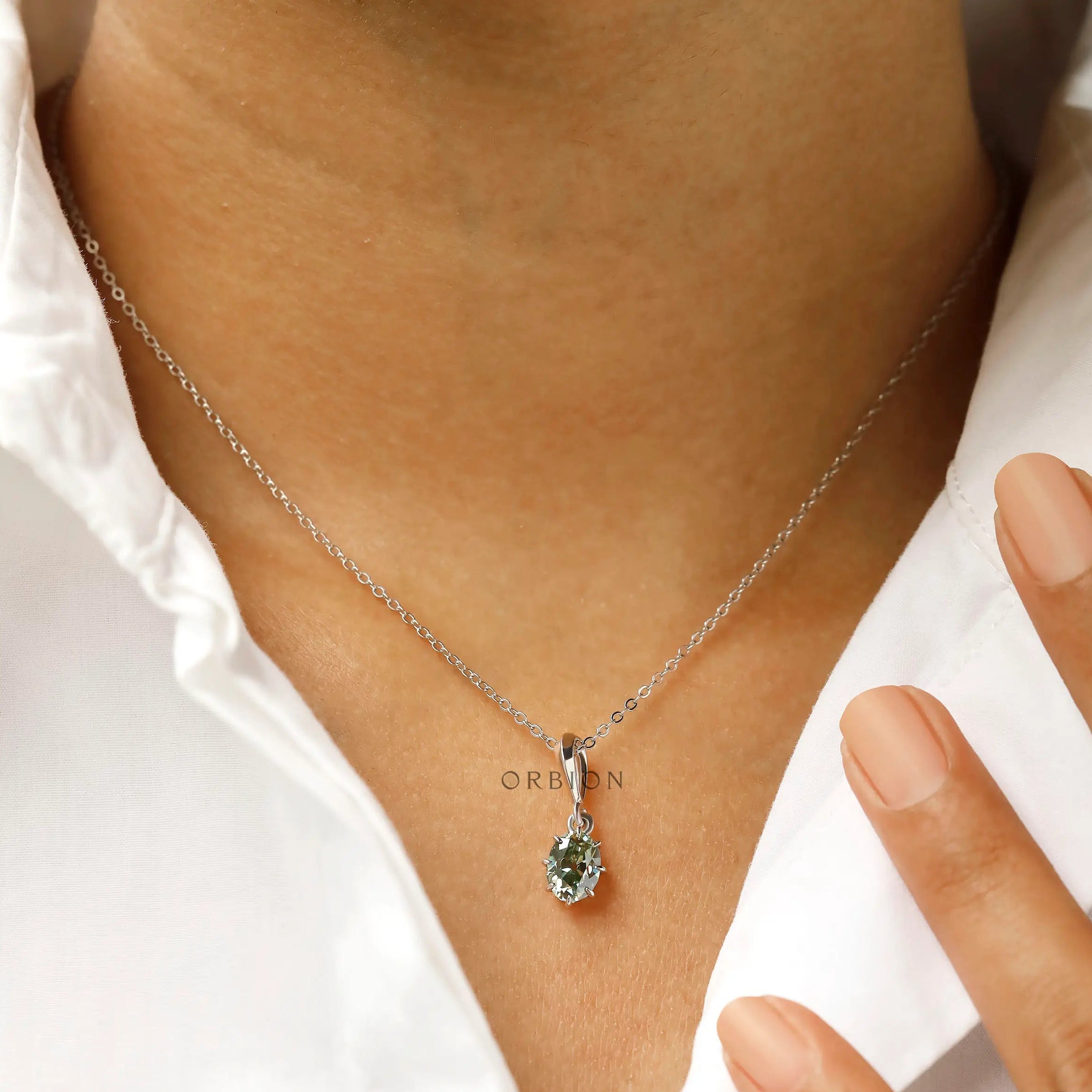 Elegant oval moissanite solitaire pendant necklace on model