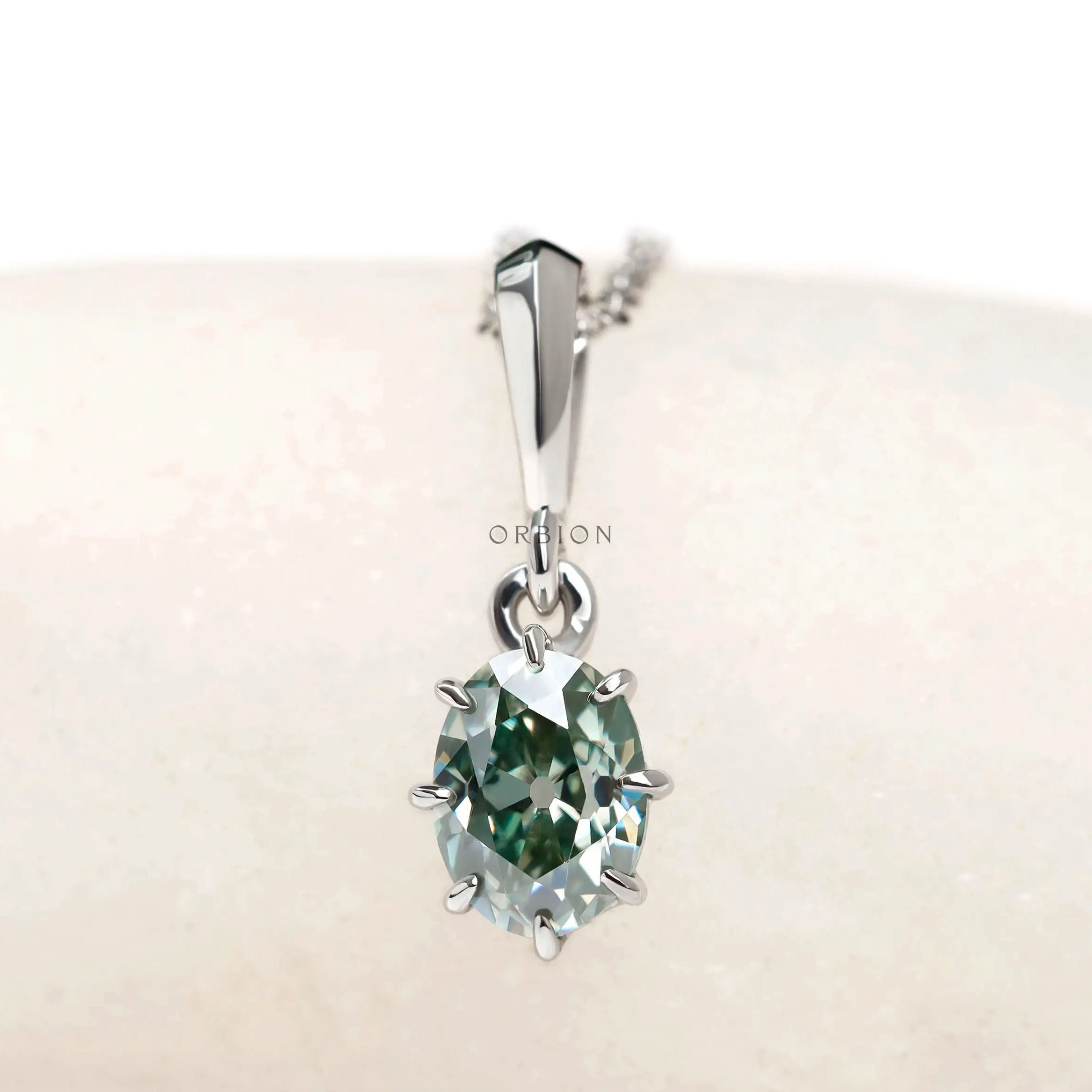 Oval old mine cut light blue green moissanite pendant in 10k white gold