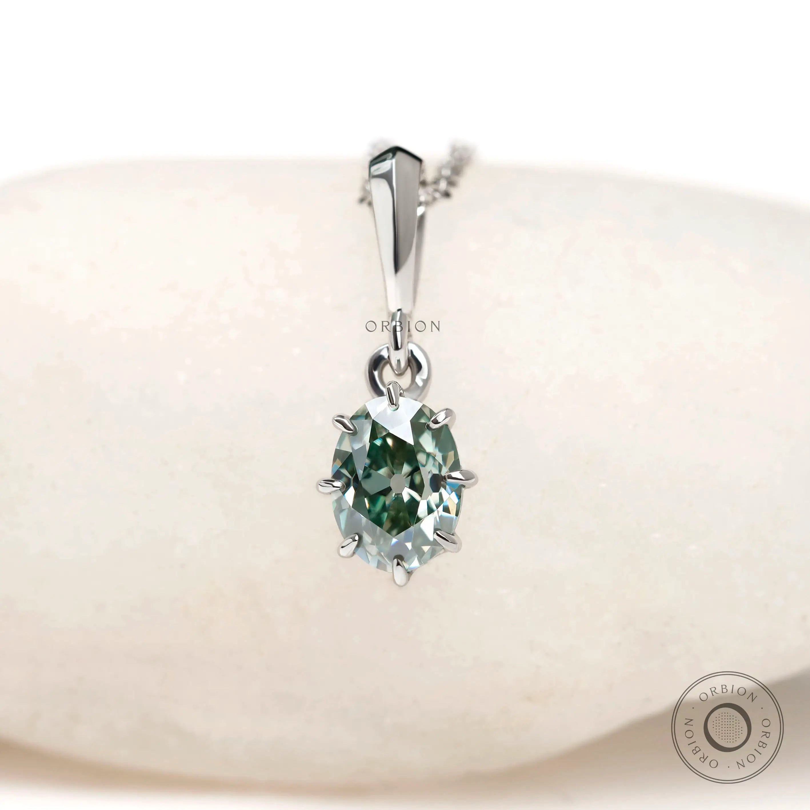 Oval old mine cut light blue green moissanite pendant in 10k white gold
