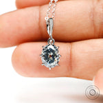Oval old mine cut bluish grey moissanite pendant in 10k white gold