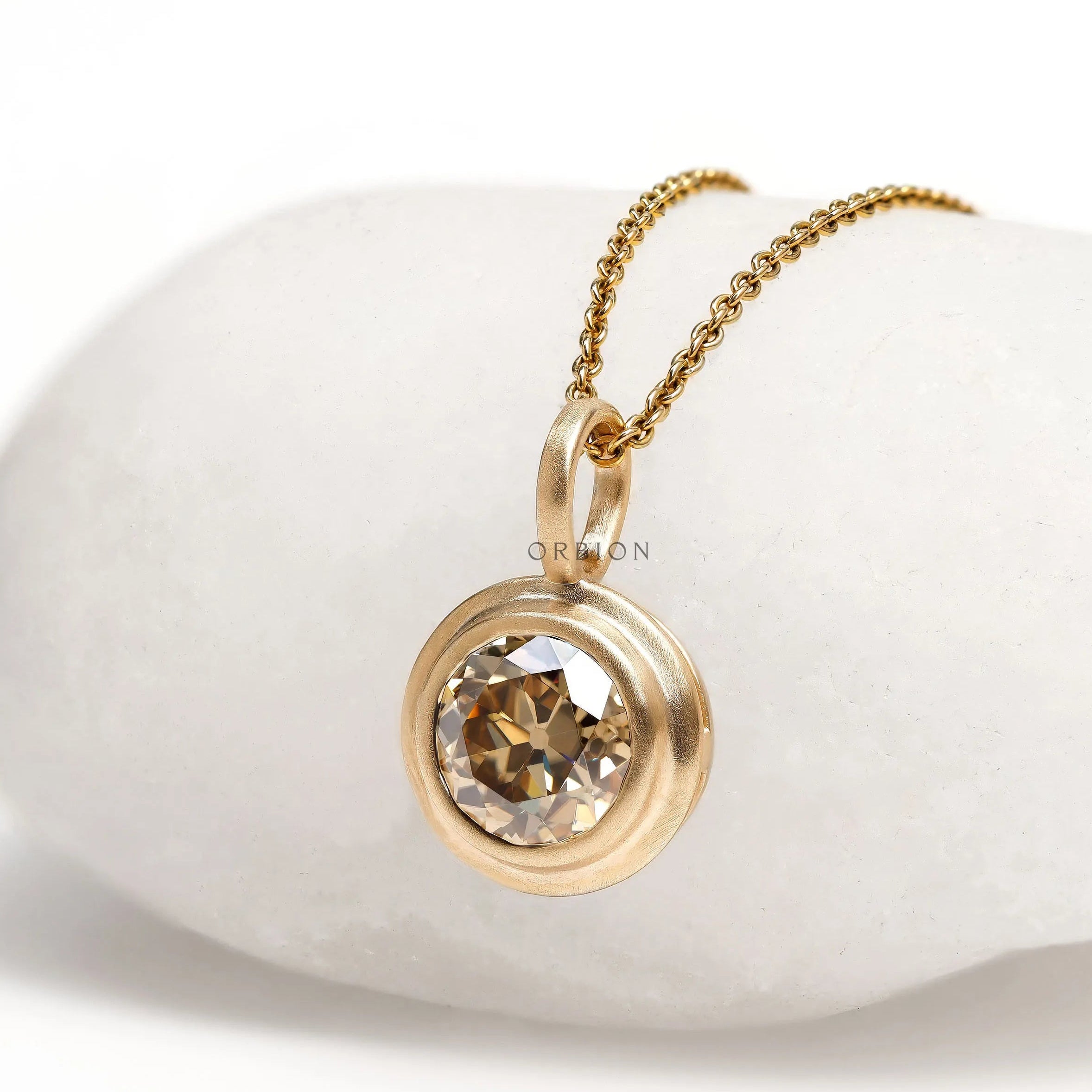 10k yellow gold bezel pendant featuring Old European cut champagne moissanite, 1.50 Ct