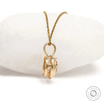 Champagne moissanite pendant with bezel setting in 10k yellow gold, brushed matte finish