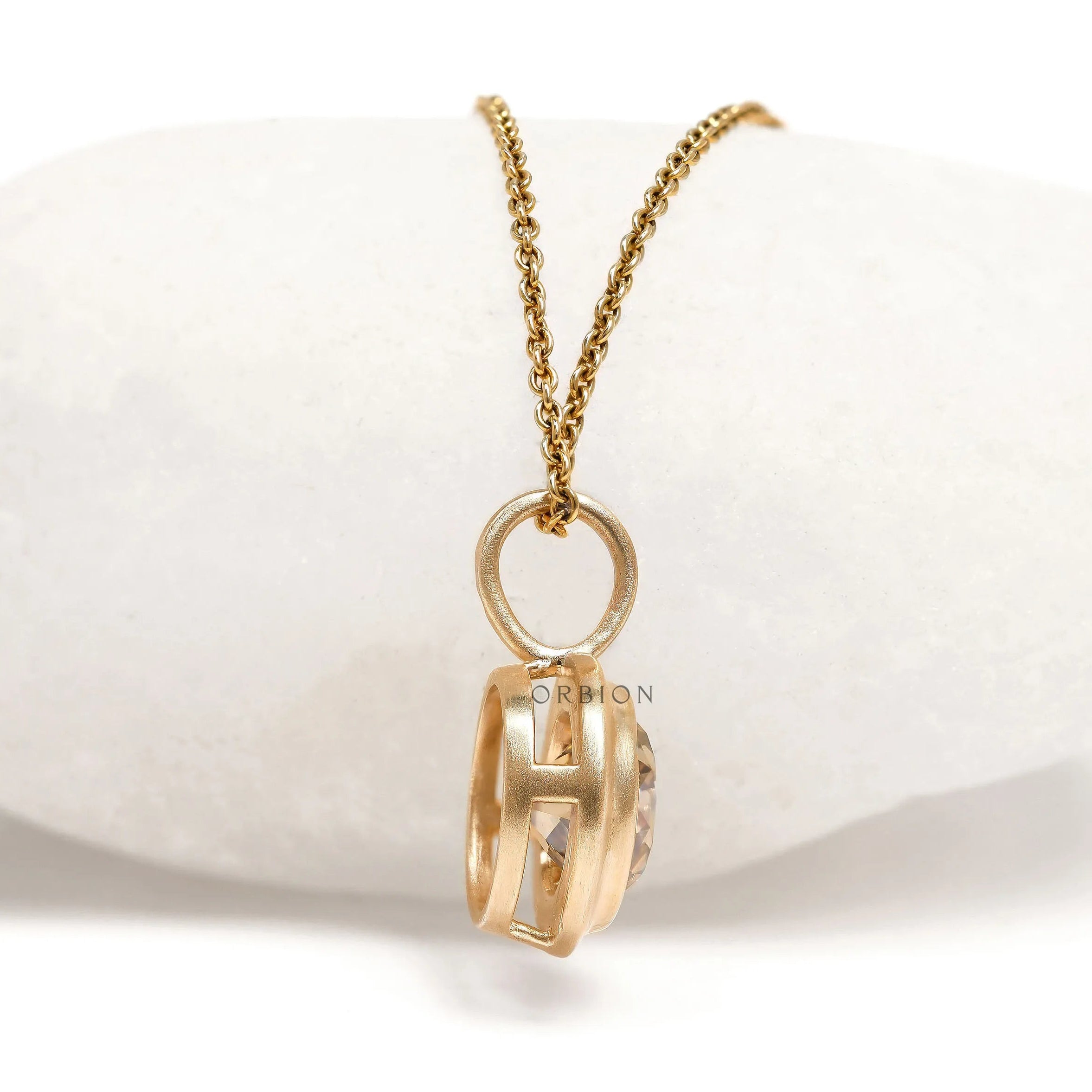 Champagne moissanite pendant with bezel setting in 10k yellow gold, brushed matte finish
