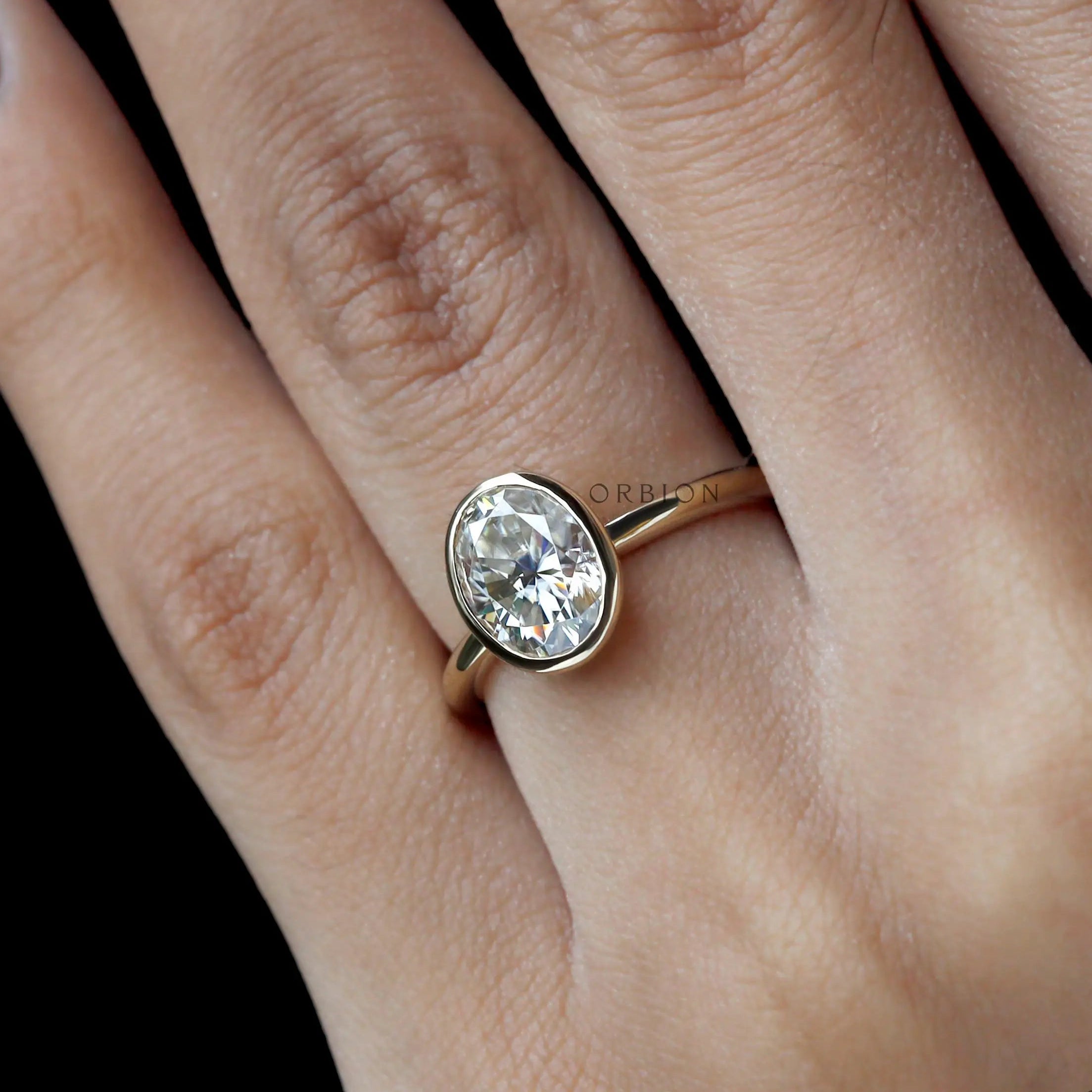Unique floating style oval lab diamond promise ring close up