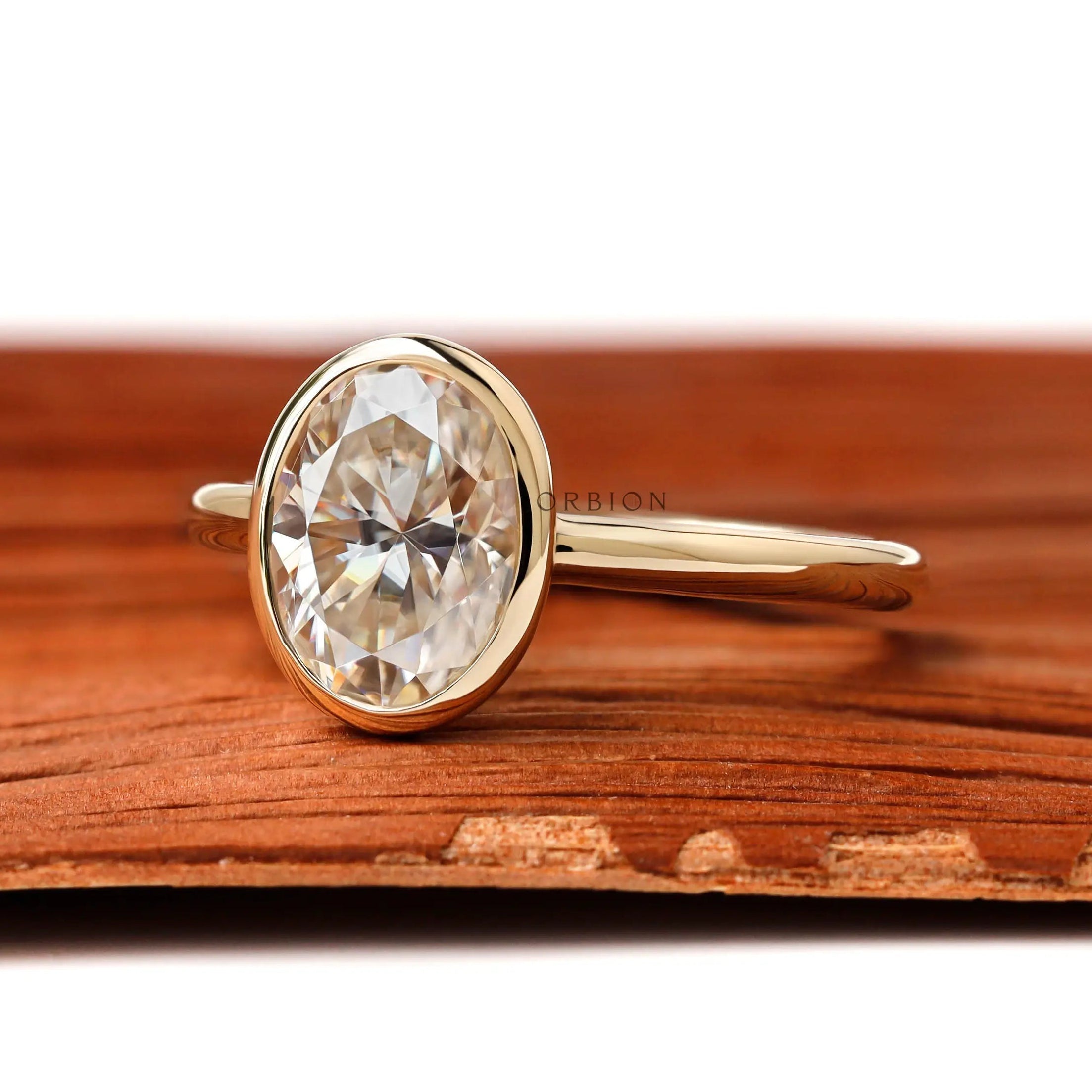 Side profile of oval bezel set solitaire ring