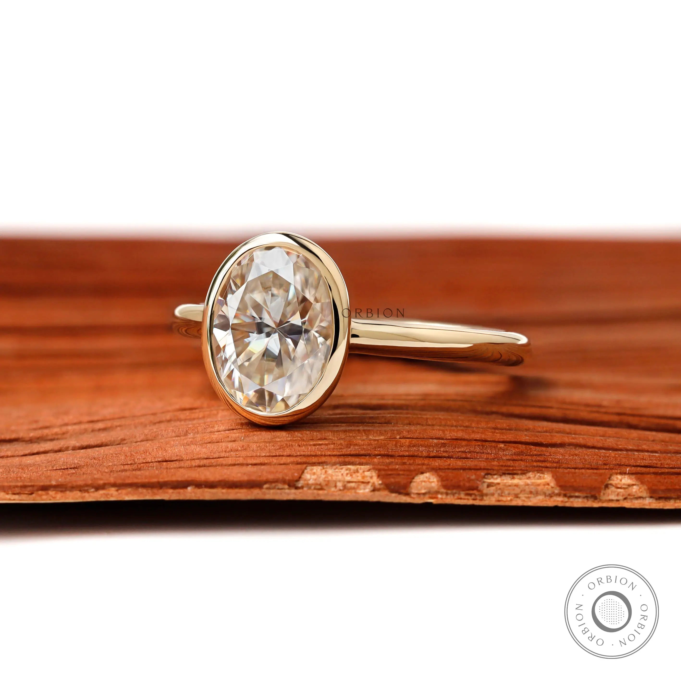 Side profile of oval bezel set solitaire ring