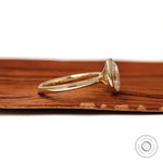 Minimal oval moissanite engagement ring glossy band detail