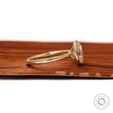 Minimal oval moissanite engagement ring glossy band detail