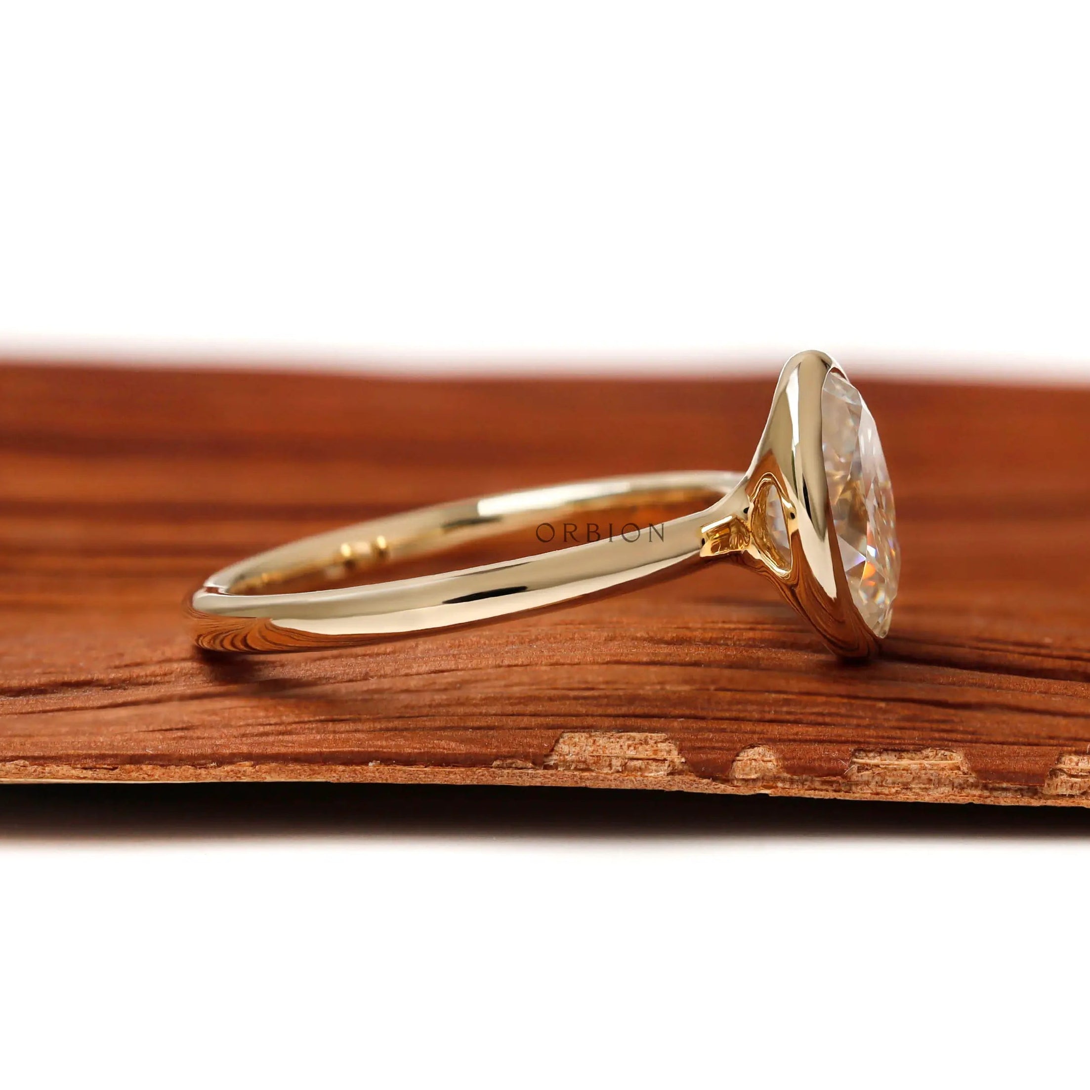 Minimal oval moissanite engagement ring glossy band detail