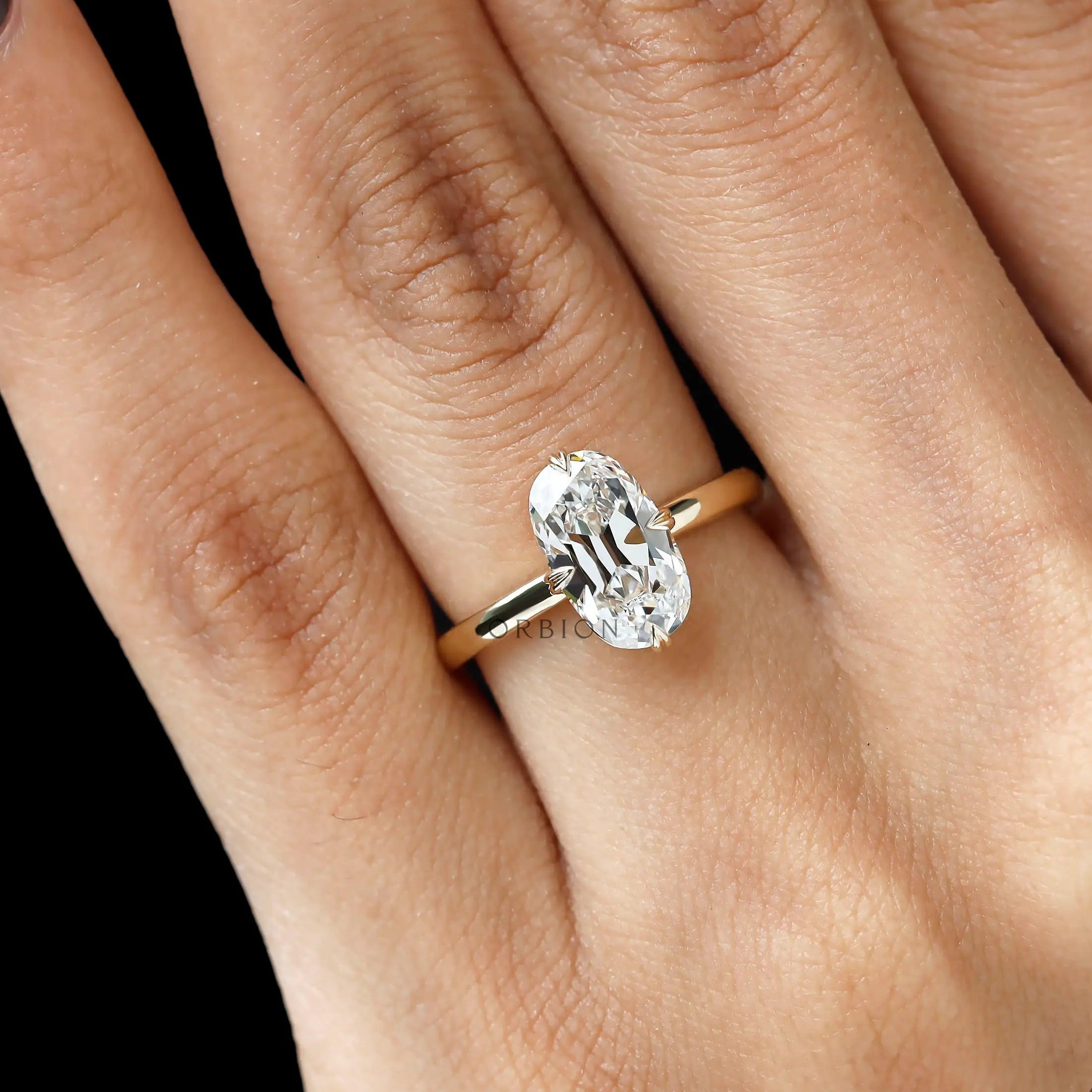 Antique style cushion solitaire ring yellow gold close up