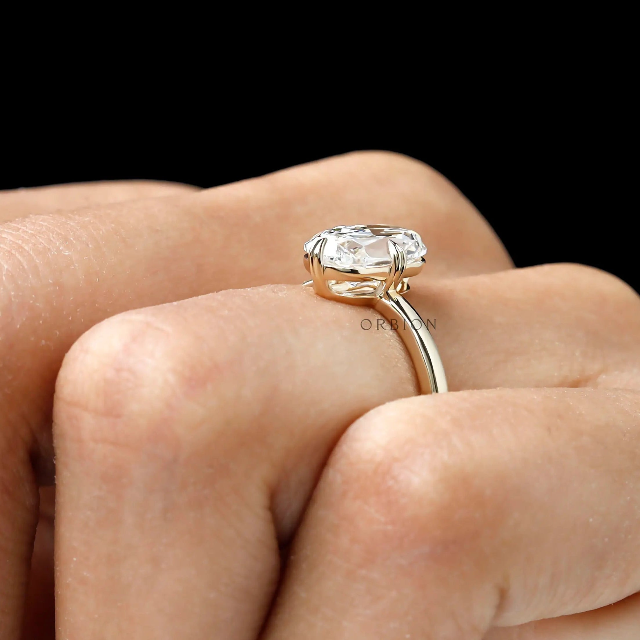 Antique style elongated cushion diamond ring hand model view
