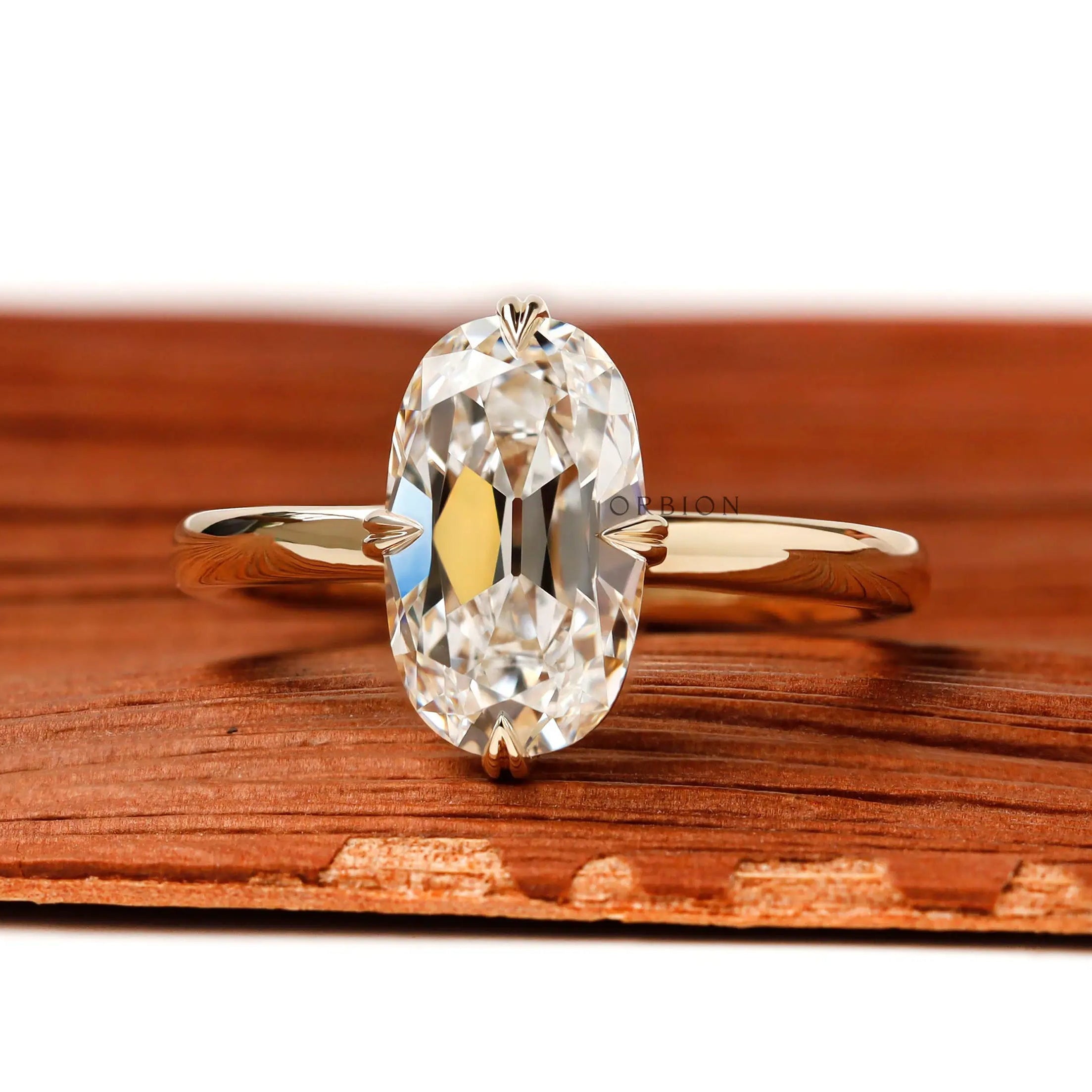 OMC elongated cushion lab diamond compass setting engagement ring yellow gold