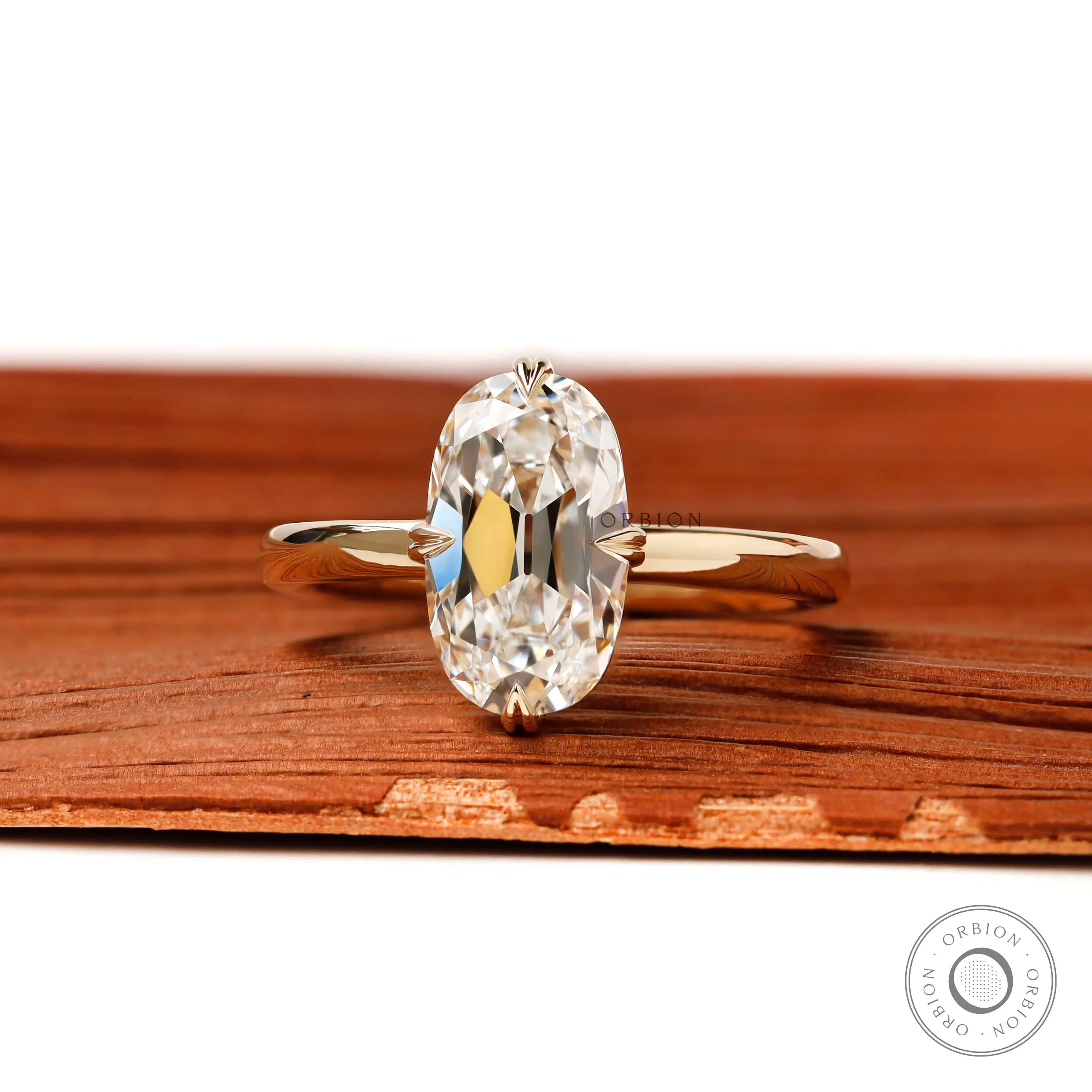 OMC elongated cushion lab diamond compass setting engagement ring yellow gold