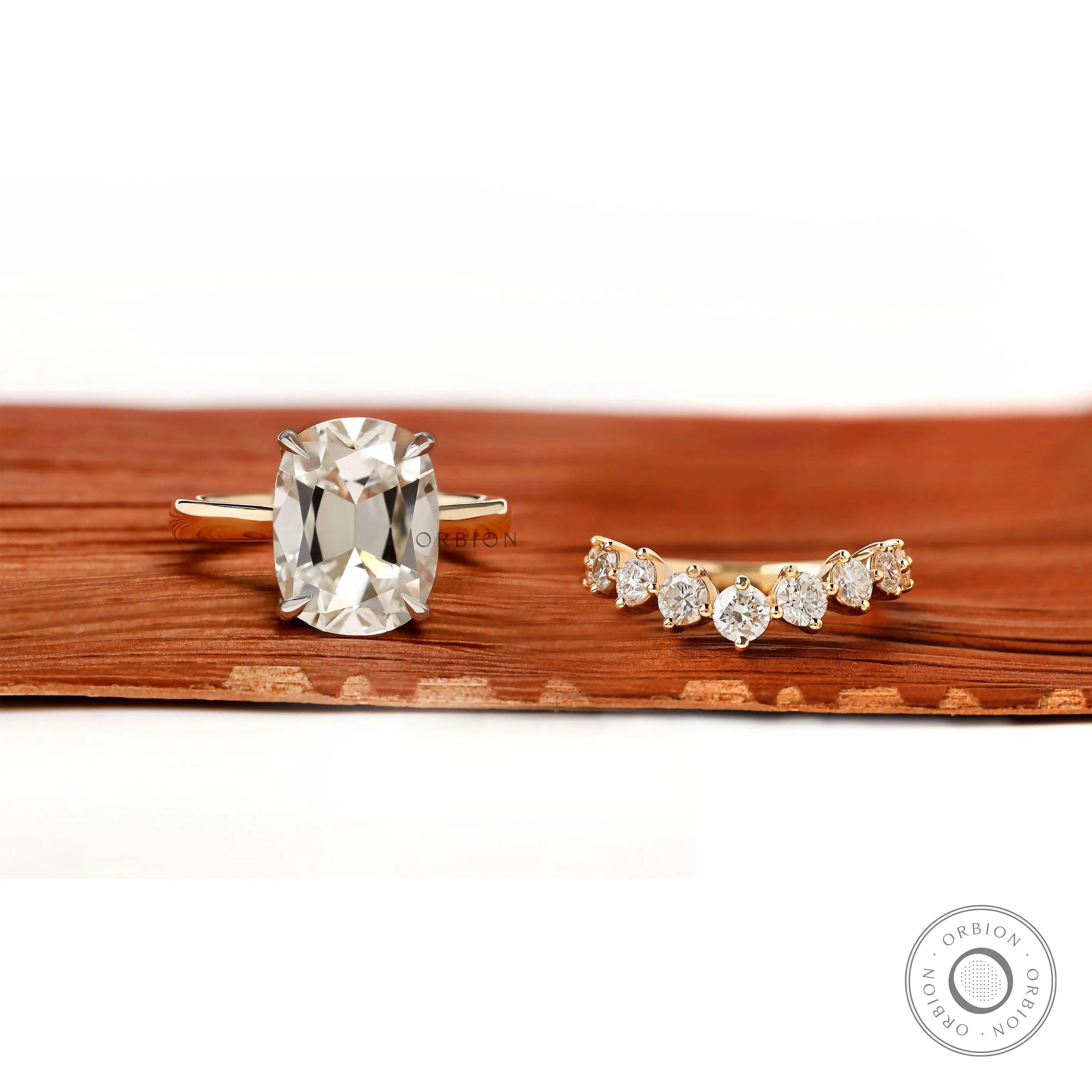 Front view of elongated cushion hidden halo ring and curved matching band