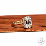 Angled front view elongated cushion solitaire dual tone ring