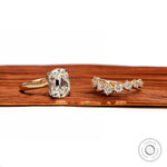 Angled front view of antique two tone ring set with curved band