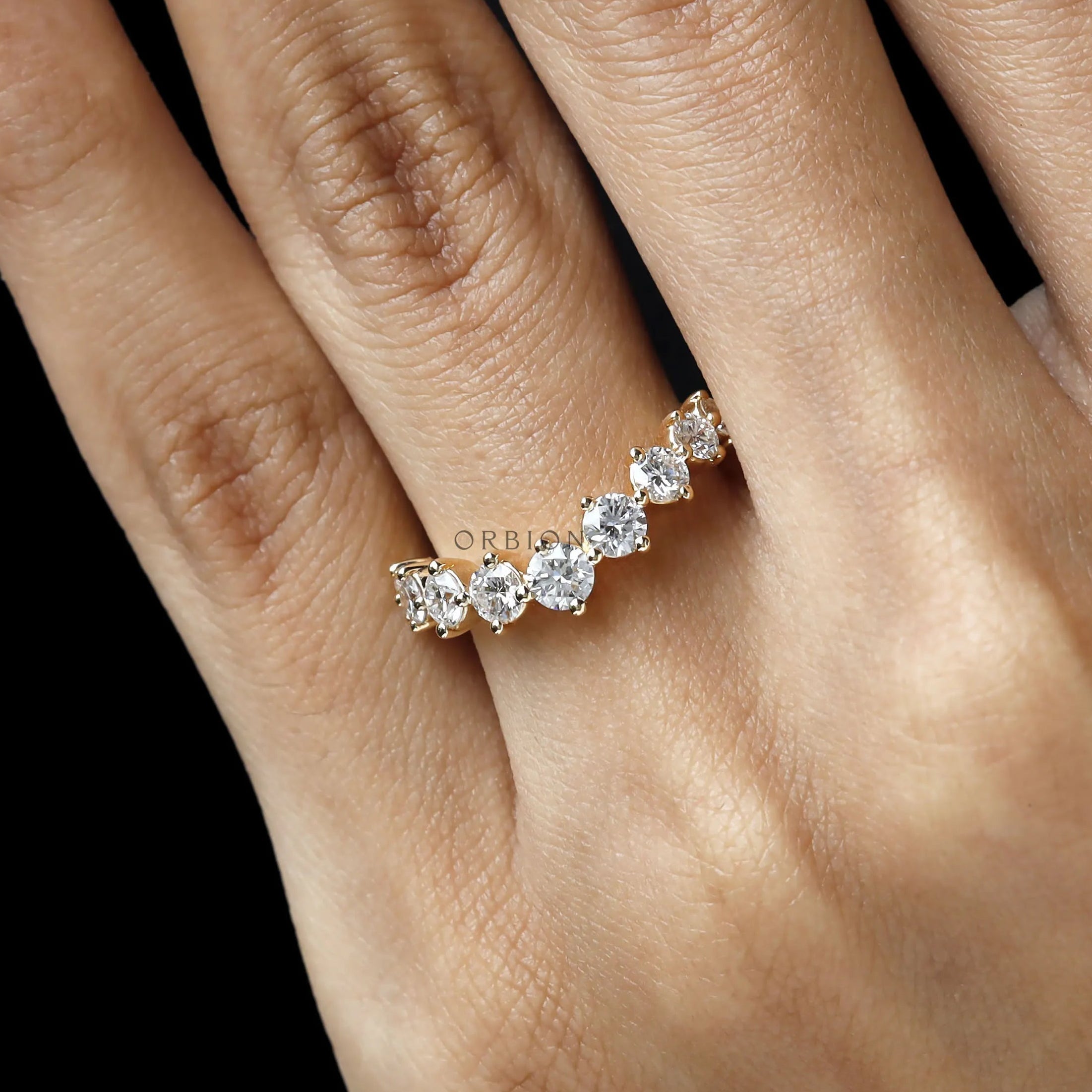 Curved stacking band with round lab diamonds in yellow gold